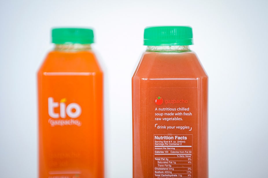 Tio Gazpacho food package design with product in clear bottles, logo, and ingredients on front.