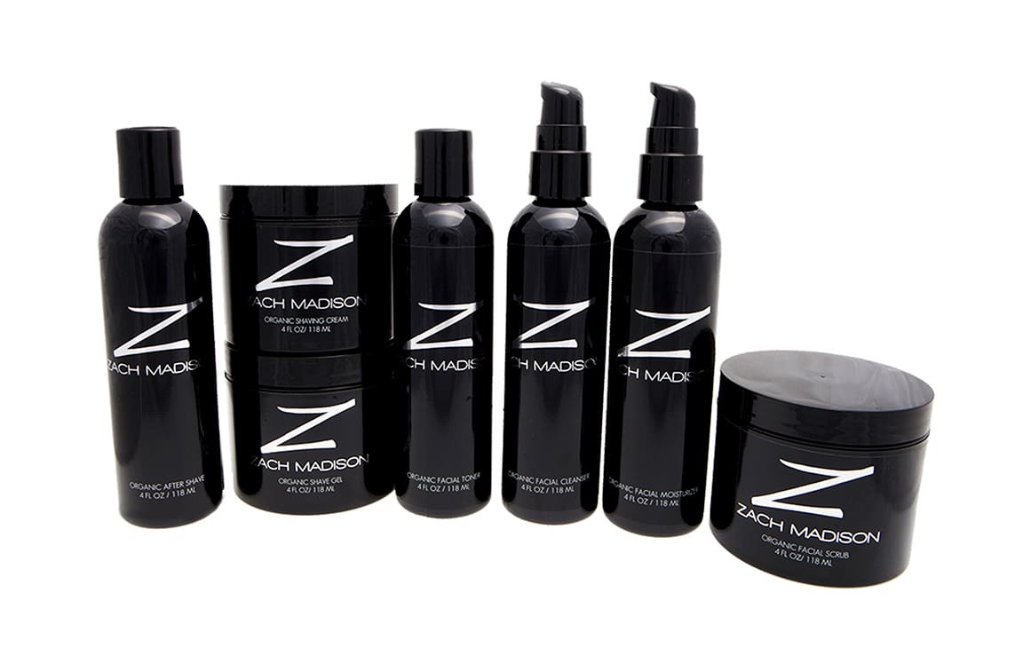 Zach Madison skincare packaging design showing an array of sleek black bottles with bold silver logo and lettering.