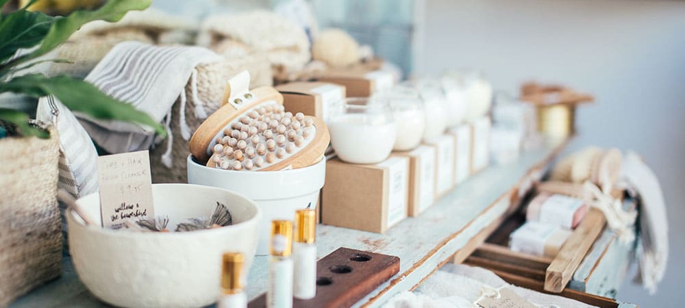 Assortment of cosmetic spa products display in shop on a table.