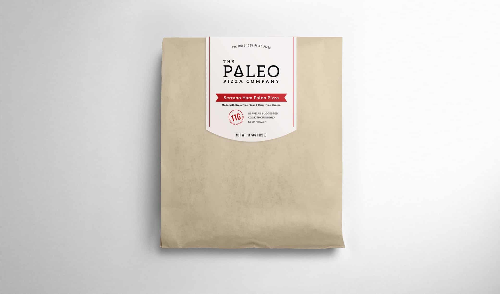 The Paleo Pizza Company packaging design in brown paper bag sealed with sticker label with logo and product description.