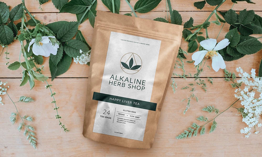 Alkaline Herb Shop dietary supplement packaging design for Happy Liver Tea with accent leaves and flowers.
