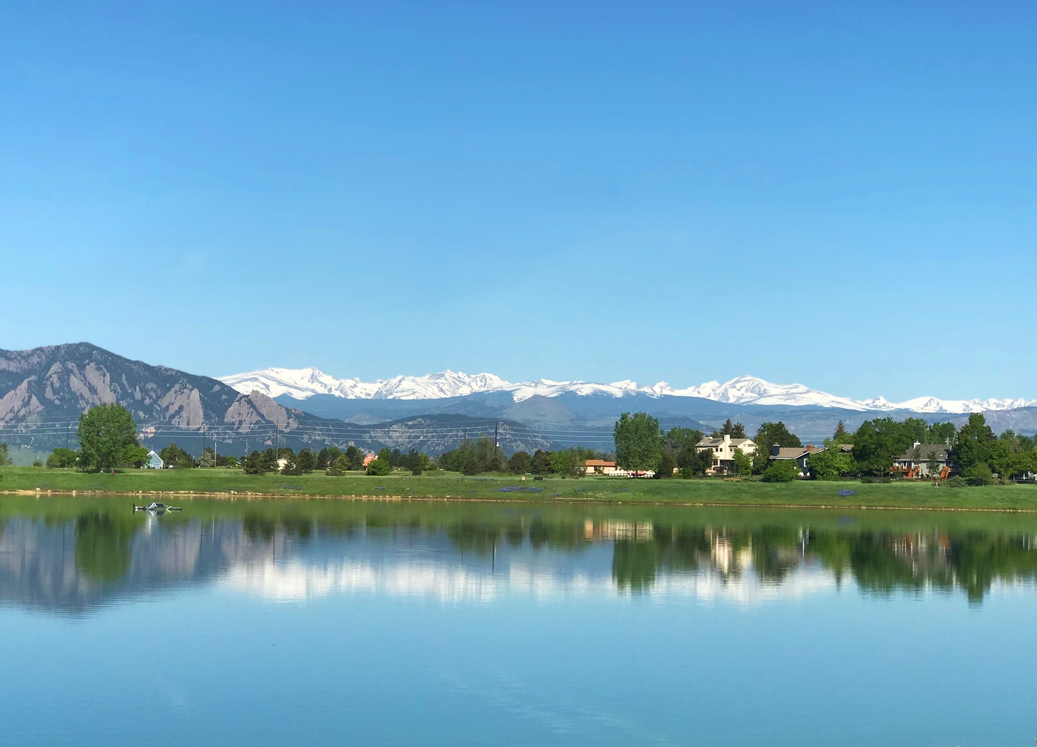 Logo design for Boulder Colorado, image showing scenery of the state's mountain, trees, and lake.