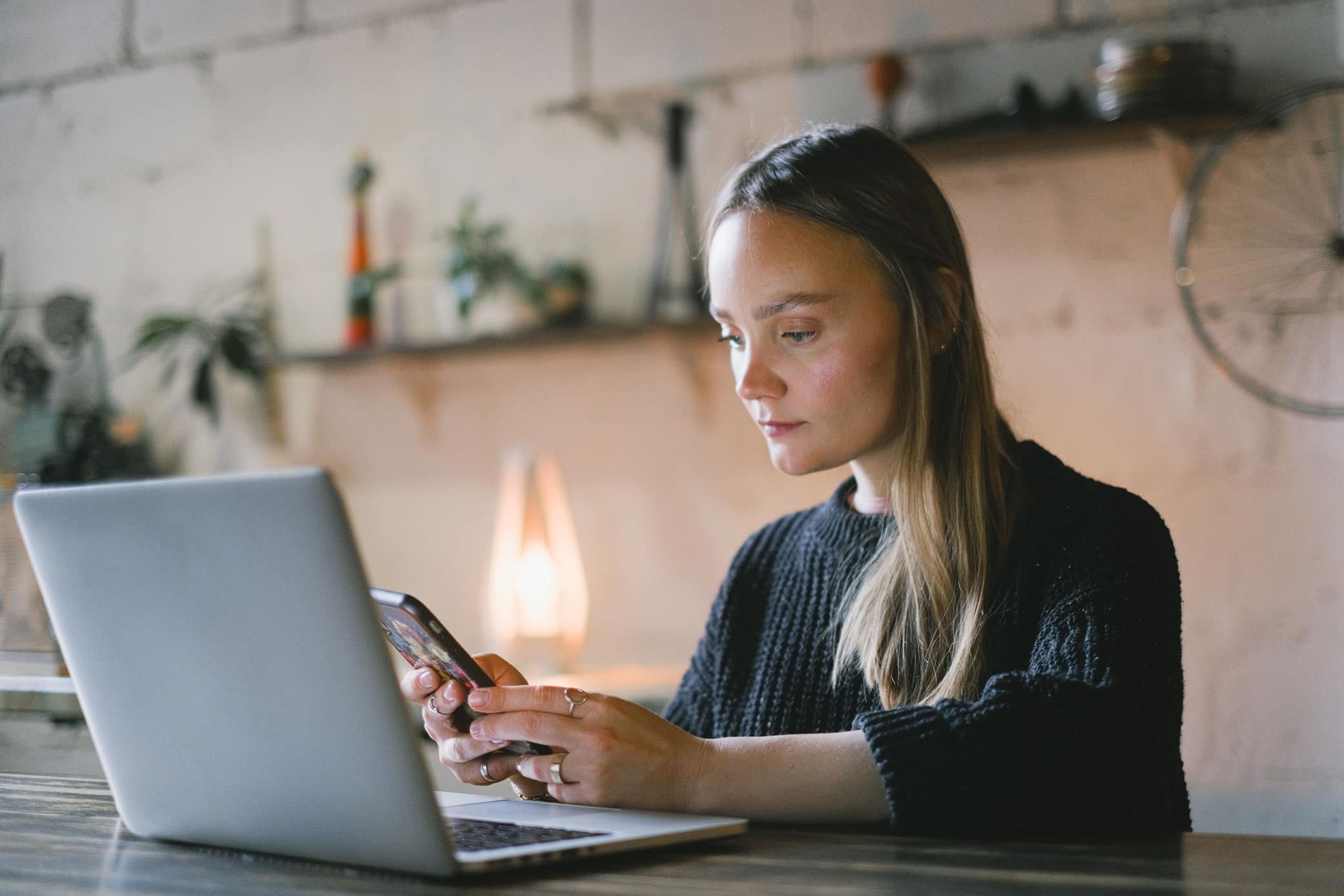 Business woman researching an online b2b wholesale marketplace on laptop.