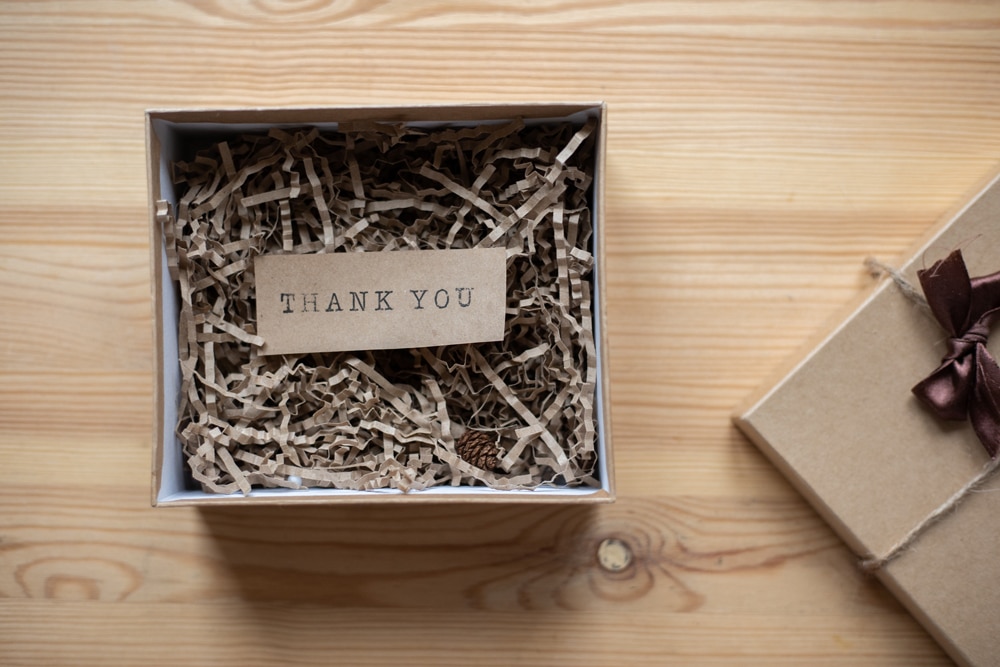 An Opened Box with a Thank You Note Inside