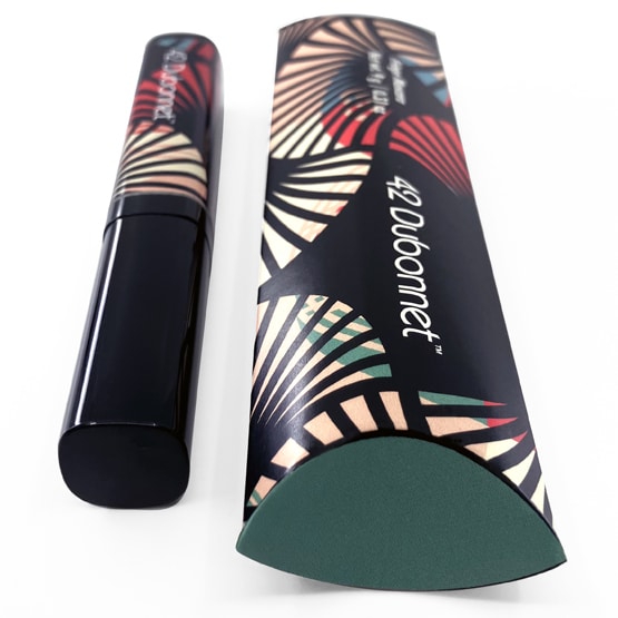 A tube of mascara and its box that has oval-shaped edges to resemble an eye