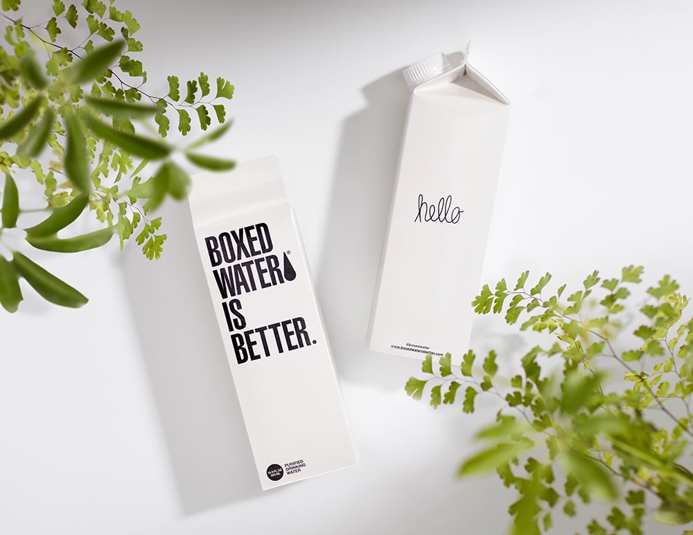 Food Packaging Trends: Two bottles of boxed water and plants as examples of recyclable packaging.