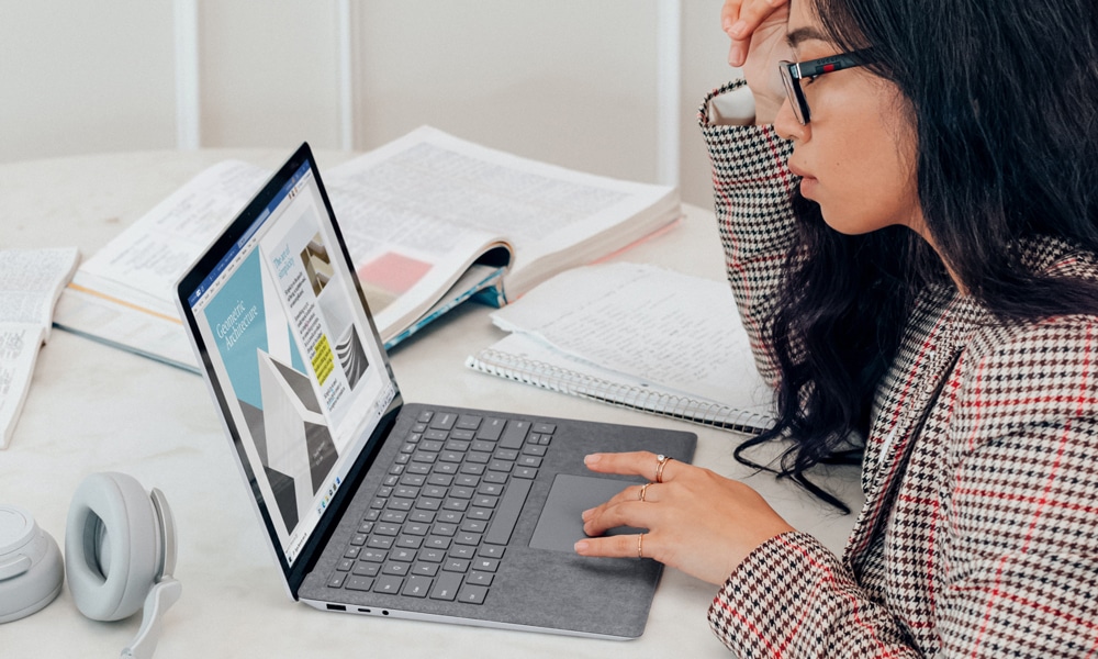 A web designer working with her laptop and designing.