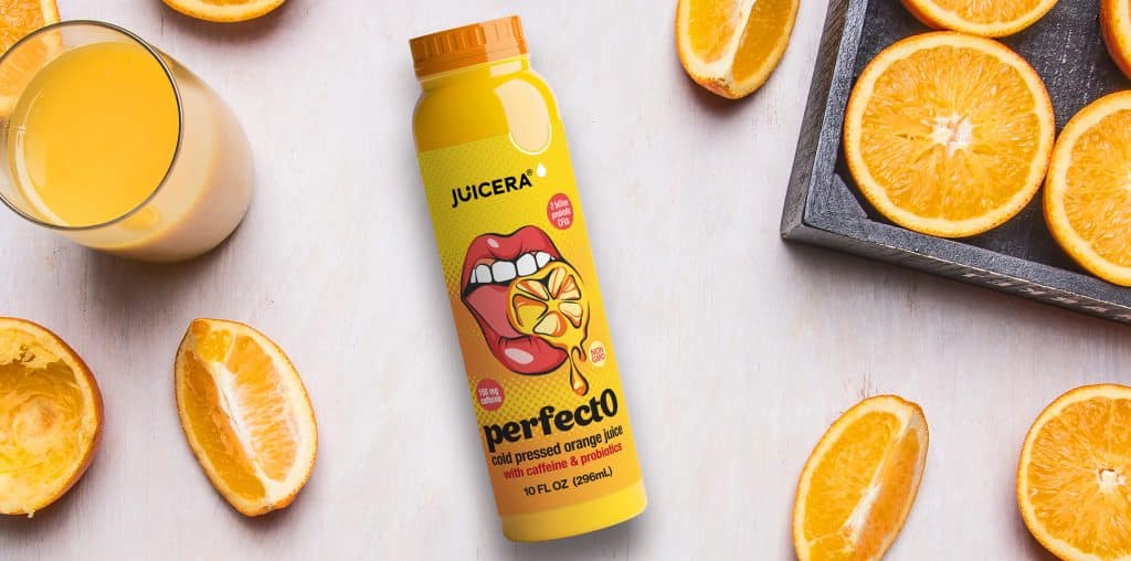 Juicera PerfectO pop art energy drink label design in bright yellow shown with oranges and glass of juice.