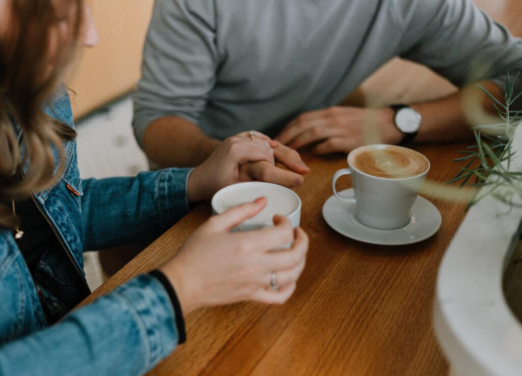 How to avoid burnout as an entrepreneur: create a support team. Woman having coffee with a friend 