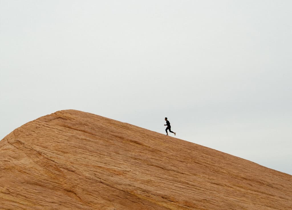 how to avoid burnout as an entrepreneur: Get in the right mindset. Man running a marathon.