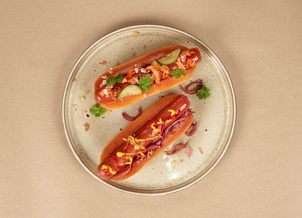 Sustainable Meat Alternatives: Showing a couple of vegan hot dogs