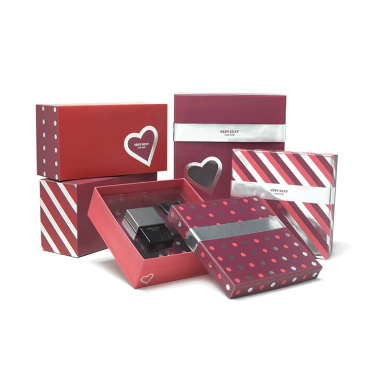 Cosmetic packaging design for Victoria's Secret Very Sexy For Him box design in silver and red with polka dots, diagonal stripes, and heart icons.