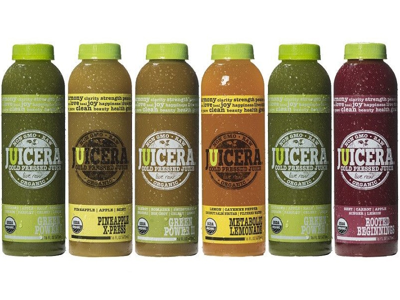 Juicera old juice packaging with green labels showcasing 6 different flavors in a row.