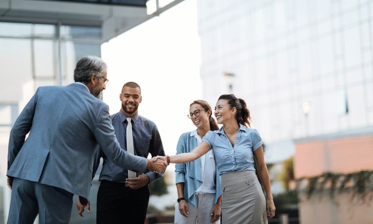 Nootropics manufacturer ideas of men and women entrepreneurs shaking hands making a deal.