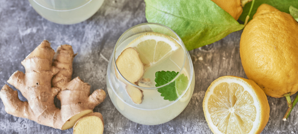 Wellness tonic drink with ingredients of ginger, lemon and fresh mint.