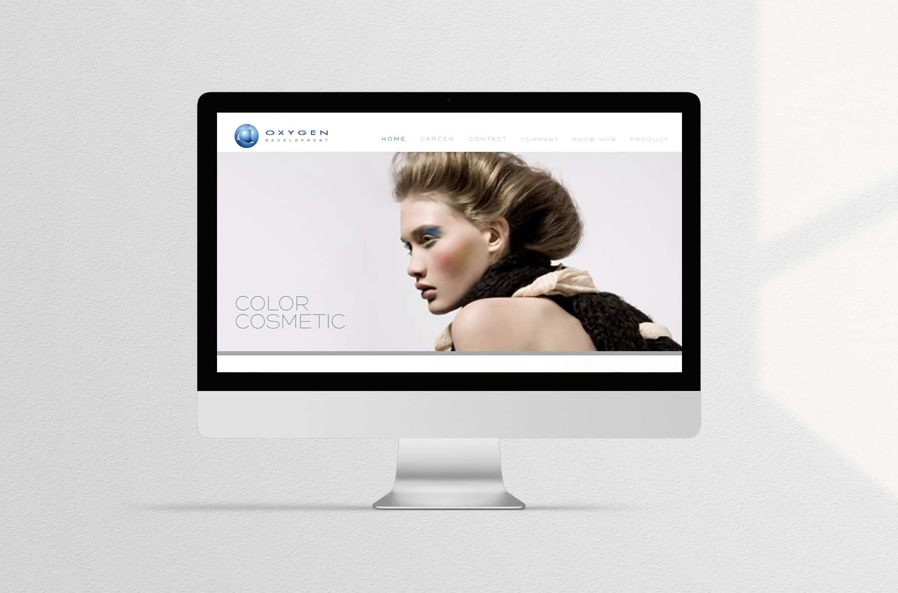 Oxygen premium website in clean white and neutral tones showing couture makeup products and flawless skincare models.
