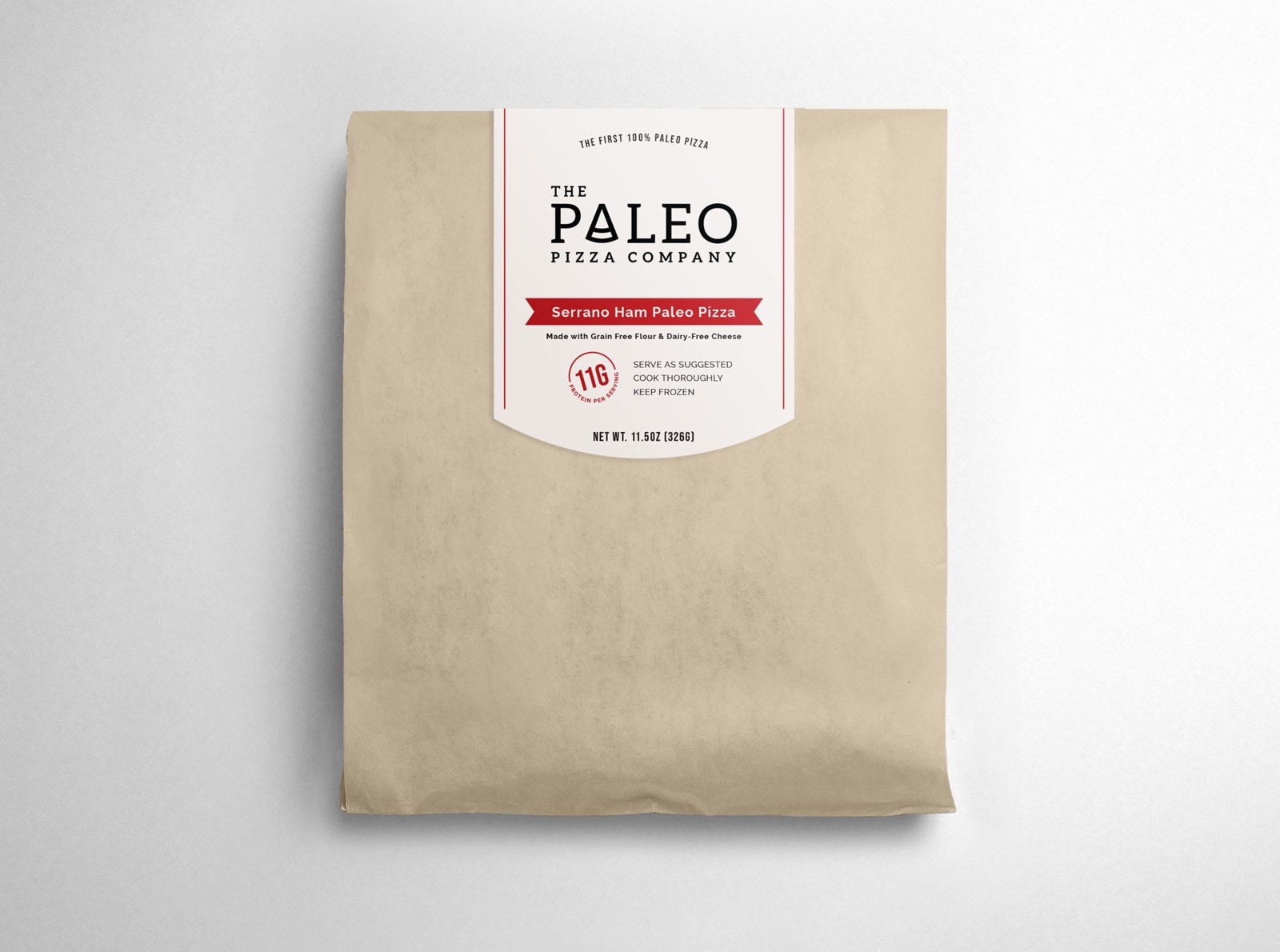The Paleo Pizza Company packaging design in brown paper bag sealed with sticker label with logo and product description.