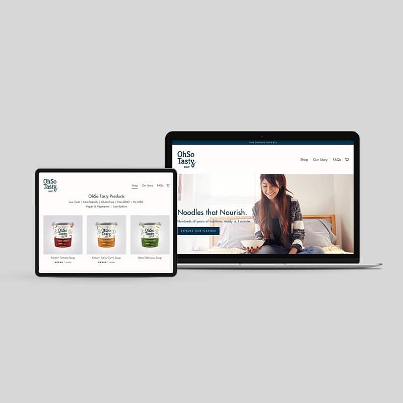 OhSo Tasty clean food and beverage web design design with hero image of a student eating while studying in bed and tagline, Noodles That Nourish.
