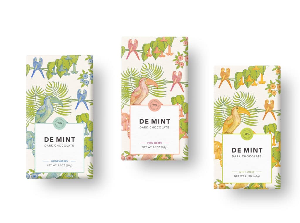 Each of the 3 chocolate bar premium packaging designs feature a colorful palette of muted blue, pink and orange combined with pops of earthy green that highlight the botanical essence of the illustrations.