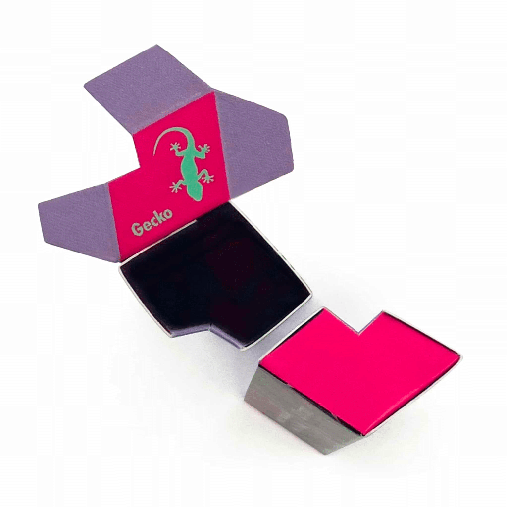 An unfolded lipstick box that is cut to look like a pair of lips when assembled