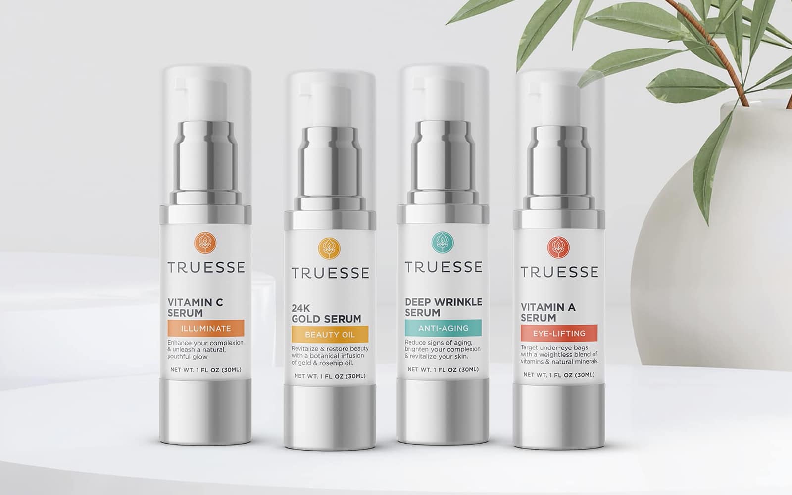 Product line of skincare serums with silver bottles, white label backgrounds, and pops of color signifying each product type